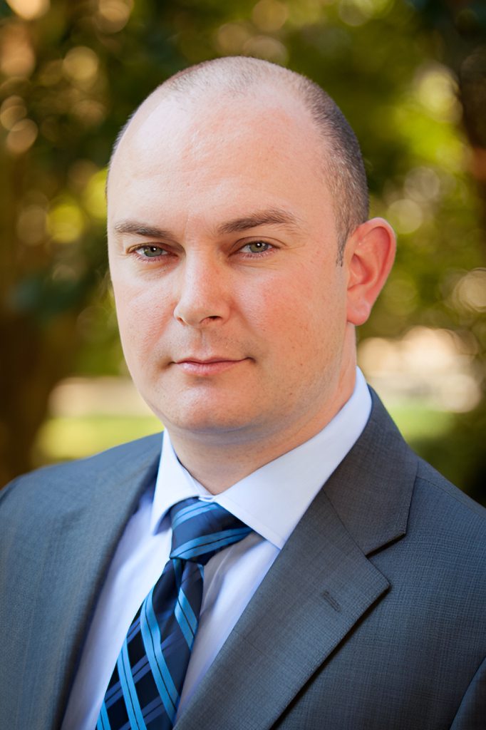 Dustin J. Mills, CEO