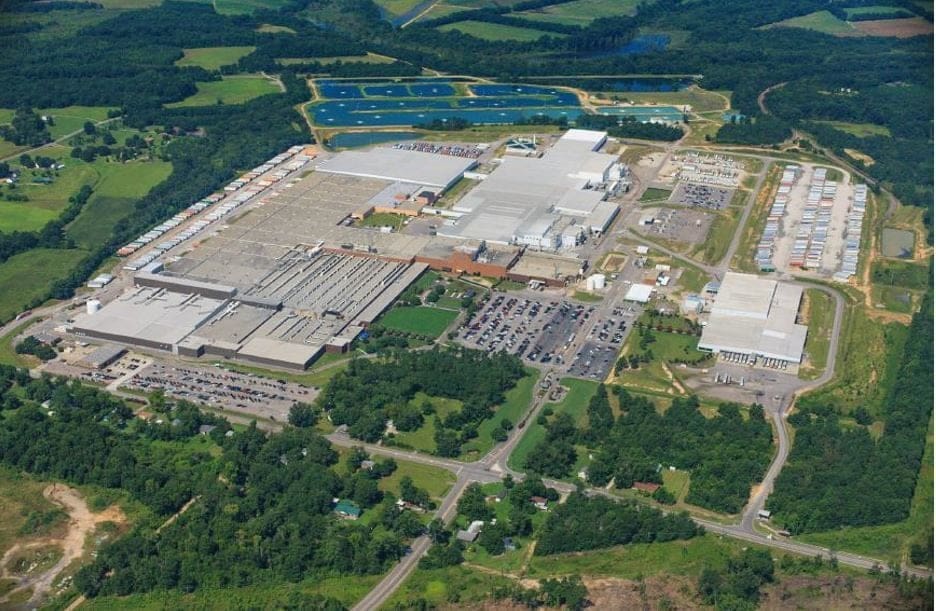 Aerial view of large industrial factory complex.